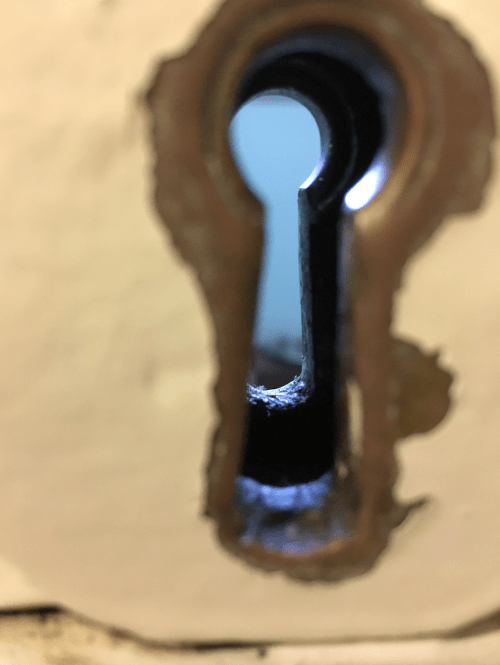 Nelson Mandela's prison cell, looking through a key hole.