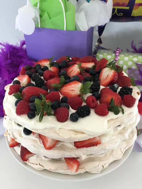 Meringue Layered Cake with Whipped Cream and Mixed Berries